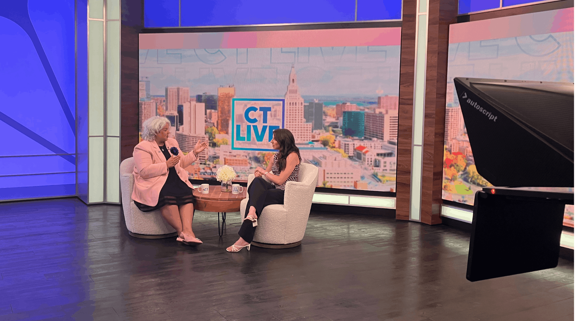 Dr. Rivera-Hainaij at a televison studio with a reporter