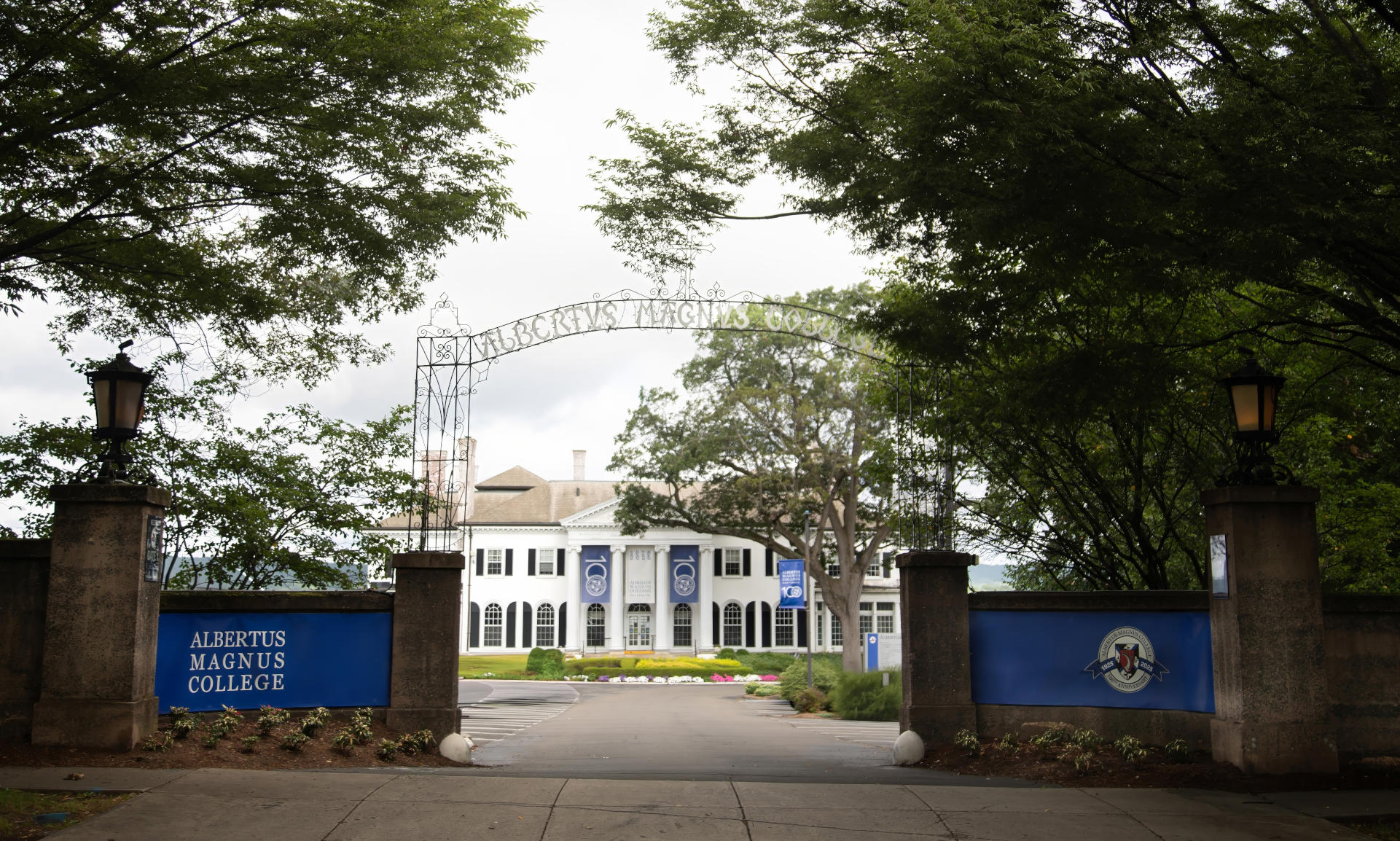 Rosary Hall through the archway Centennial banners