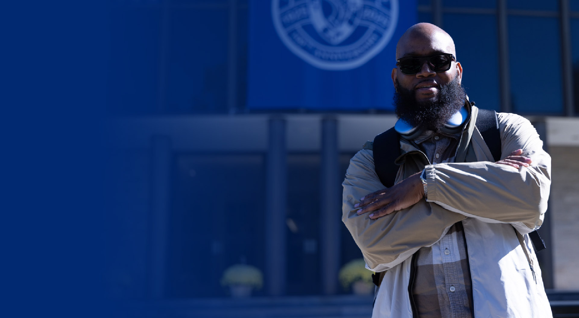 Male student standing in front of Campus Center