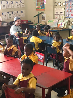 Albertus Magnus College students community service in an elementary school in Jamaica