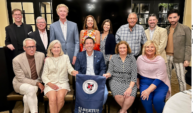 Palm Beach Alumni event group photo with President Camille and Alumni