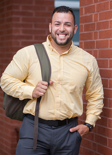 Student Standing on Wall