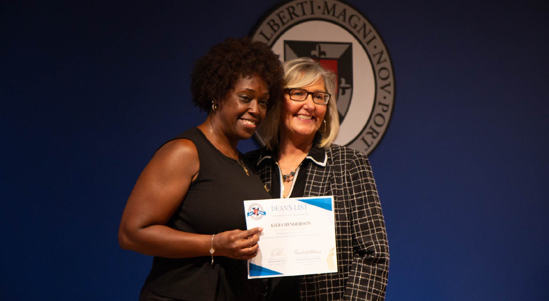Student accepting Dean's List honor