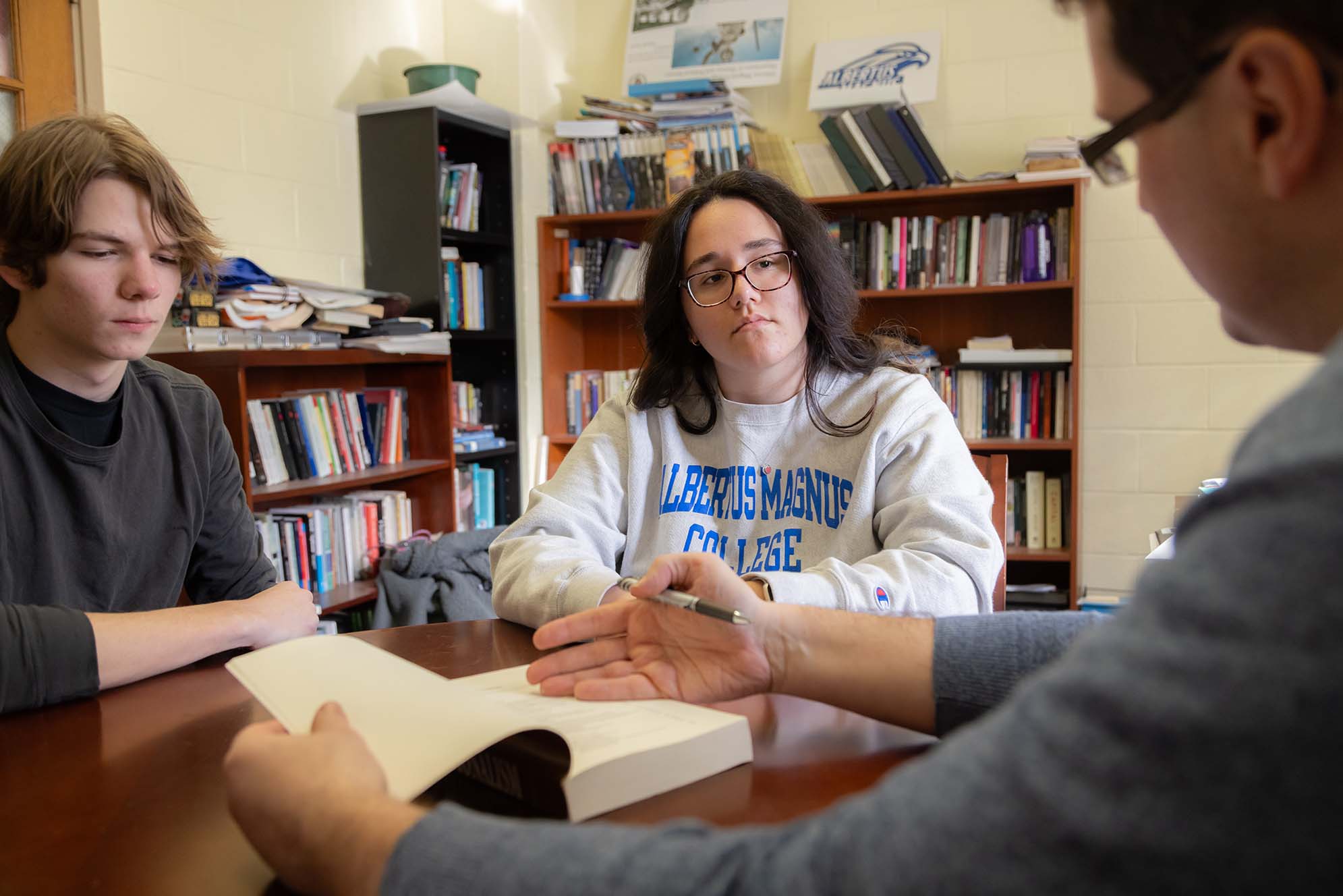Teacher meeting with students