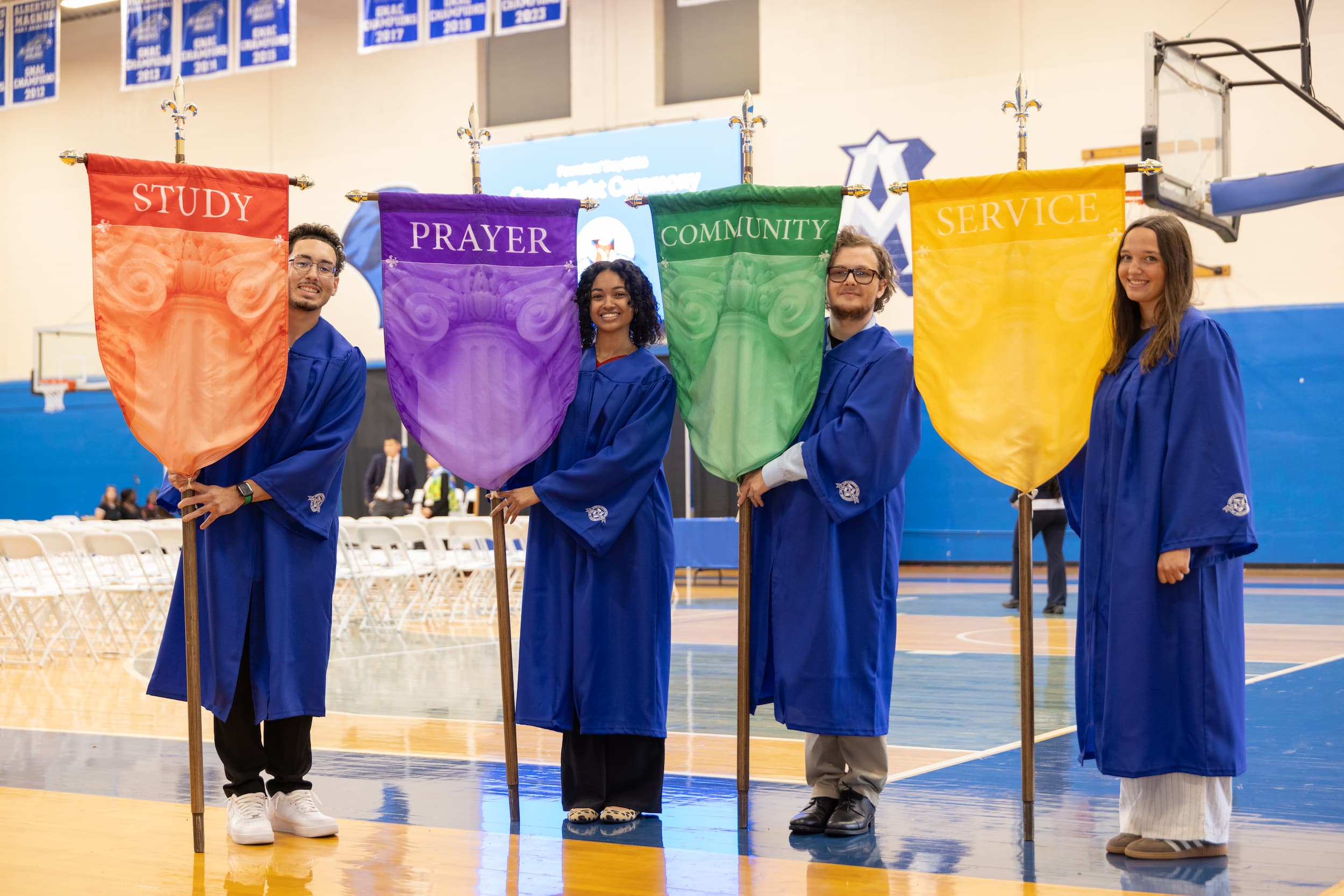 Students holding the four banners